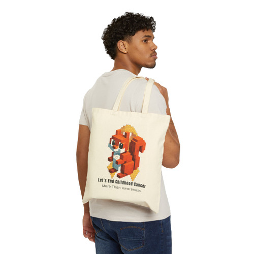 Man carrying End Childhood Cancer canvas tote over shoulder — cause-forward daily carry — Coo Coo’s Coffee