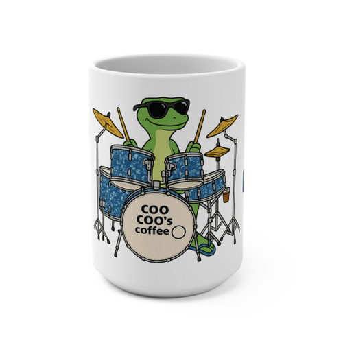 15oz white coffee mug with Bert the green gecko playing a blue drum kit and the text ‘Geckos Don’t Sleep, They Drum!