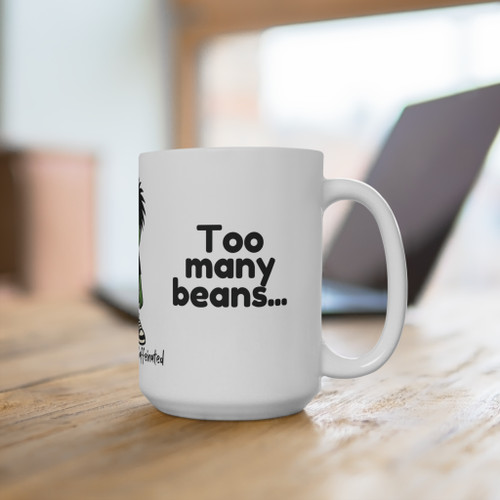 Bean Mood Swing – Need Beans, Too Many Beans mug on a wooden table in a cozy workspace.
