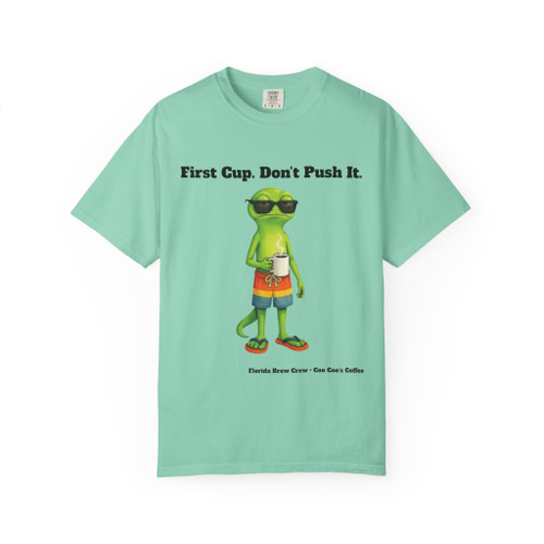 First Cup Don't Push It tee - Bert the gecko standing in sunglasses board shorts and flip flops holding coffee cup - front print on mint green ring-spun cotton by Coo Coos Coffee Florida Brew Crew