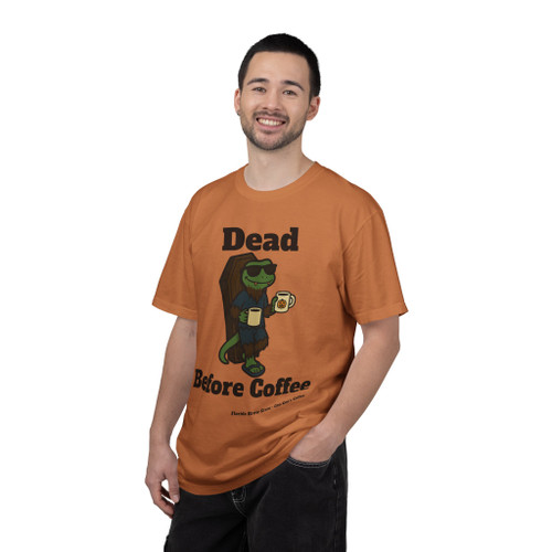 Dead Before Coffee Halloween tee - Bert the gecko climbing out of coffin holding coffee mug - front print on burnt orange ring-spun cotton by Coo Coos Coffee Florida Brew Crew