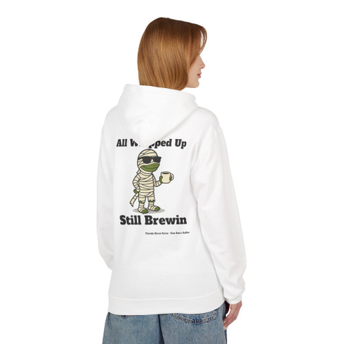 All Wrapped Up Still Brewin Halloween hoodie - mummy Bert the gecko wrapped in bandages holding coffee with sunglasses - back print seasonal drop fleece pullover by Coo Coos Coffee Florida Brew Crew