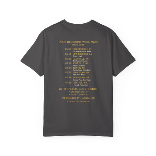 Back of the Bert & the Bean Shredders tee — a classic band tour back print: "Pour Decisions Were Made — Tour 2026" over a list of coffee-pun tour dates and venues (the Bean Machine Arena, Crema Coliseum, Caffeine Cathedral and more), with special guests SBOF and "Fresh Roast — Loud Life" — Coo Coo's Coffee tour merch.
