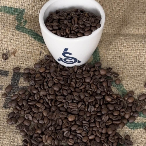 SCA cupping bowl with dark roasted coo coo's coffee beans