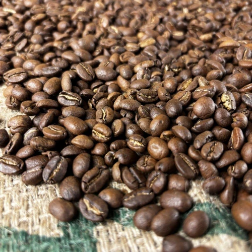 Light roast coffee beans on a coffee burlap bag