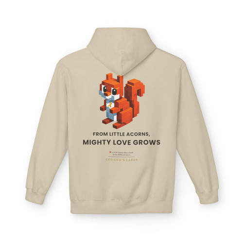 Our block-built squirrel — brave, small, and unmistakably himself — holds his gold ribbon beneath the line we believe in: from little acorns, mighty love grows.  $7 from every hoodie goes to help families facing childhood cancer. hoodie sands