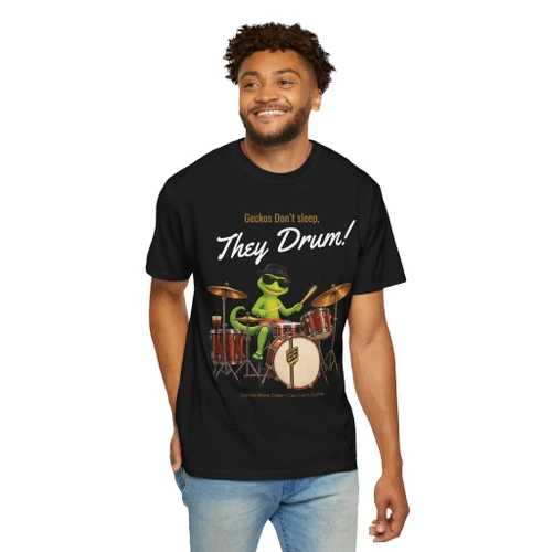 Person wearing the Geckos Don’t Sleep, They Play Drums coffee t-shirt from Coo Coo’s Coffee, black