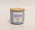 Just Lavender jar candle with purple label and soft glowing flame – Coo Coo’s Coffee