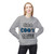 Sport Grey crewneck sweatshirt featuring the bold “Coo Coo’s Coffee” logo in black and blue paw-print lettering across the chest. female Model