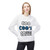 White crewneck sweatshirt featuring the bold “Coo Coo’s Coffee” logo in black and blue paw-print lettering across the chest. Female Model
