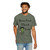 cream tee with frazzled green gecko (Bert) holding coffee cup and text “Brew First Think Later” – funny coffee shirt by Coo Coo’s Coffee