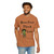 white t-shirt with a frazzled gecko holding coffee and the phrase “Brew First, Think Later – Fueled by Coo Coo’s Coffee”
