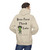 light gray hoodie with frazzled green gecko holding a coffee cup and the text “Brew First, Think Later – Fueled by Coo Coo’s Coffee”