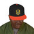 black snapback hat with embroidered Bert surfing badge and yellow bill – Coo Coo’s Coffee