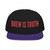 black snapback hat with red “brew is truth” embroidery and purple brim – coo coo’s coffee bold cap