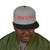 black/grey snapback hat with red “brew is truth” embroidery and purple brim – coo coo’s coffee bold cap