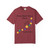 Chili bravery beads tee lying flat with colorful bead-heart design and “Every Bead Tells a Story. Help Stop The Poke.” text.