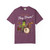 Geckos Don’t Sleep, They Play Drums coffee t-shirt — cartoon gecko Bert drumming, caffeine-and-music printed on the front, berry