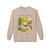 Chapters & Cappuccinos coffee crewneck sweatshirt — Gertie reading with a cappuccino, cozy book-lover art printed on the front, sand
