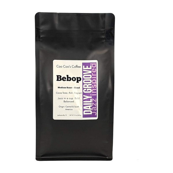 Coo Coo’s Coffee Bebop medium roast blend, 12oz black bag with purple Daily Groove strip—cocoa-rich, balanced whole bean coffee Coo Coo’s Coffee Bebop medium roast blend, 12oz black bag with purple Daily Groove strip—cocoa-rich, balanced whole bean coffee