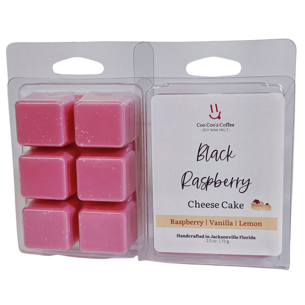 Black Raspberry Cheesecake Wax Melt in a clamshell package with six deep pink cubes and a label highlighting raspberry, vanilla, and lemon notes.