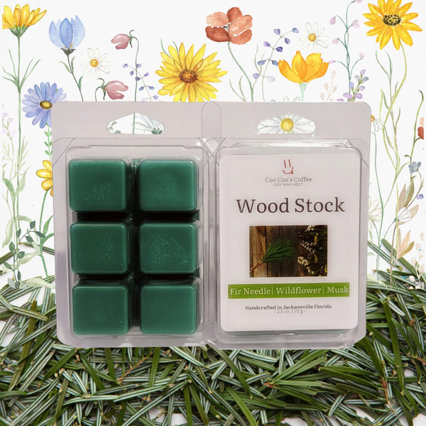 Wood Stock wax melt clamshell on fir needles and wildflower background