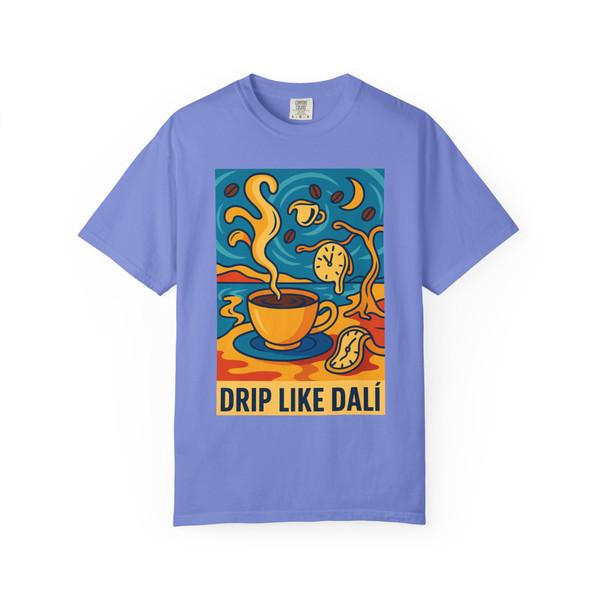 Drip Like Dalí – Surrealist Coffee Tee by Coo Coo’s Coffee in flo blue, with surreal artwork of steaming coffee and dreamlike clocks.