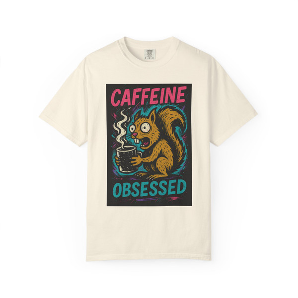 Caffeine Obsessed – Squirrel Mode Activated Tee in ivory, playful squirrel graphic, by Coo Coo’s Coffee.