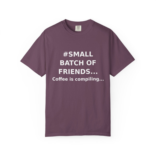 “Coffee Is Compiling – Brew Crew Debug Tee by Coo Coo’s Coffee in berry red, playful caffeine-meets-coding shirt for coffee geeks.”