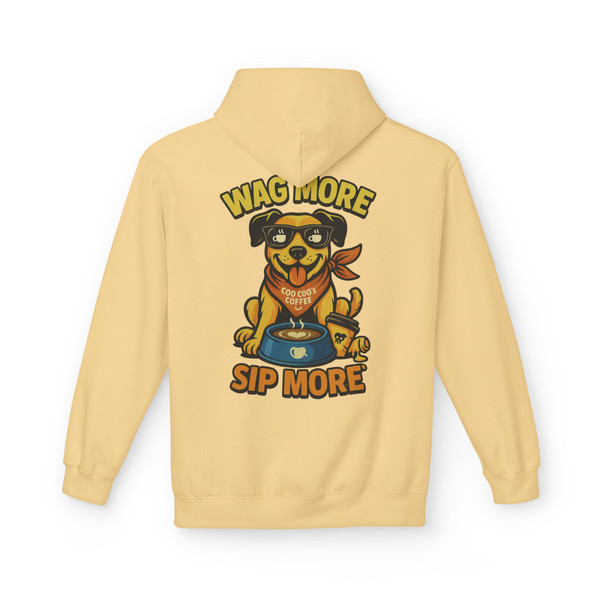 Yellow haze hoodie with “Wag More, Sip More” Coffee Pup print by Coo Coo’s Coffee, playful dog illustration with coffee bowl and cheerful brand vibe.