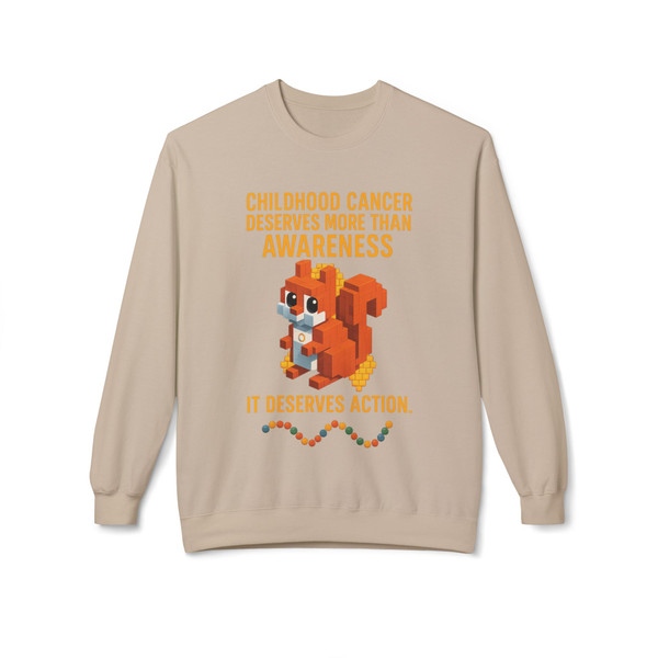 Sand “It Deserves Action – Childhood Cancer Tribute Sweatshirt” by Coo Coo’s Coffee. Pixel squirrel and gold ribbon tribute graphic highlighting childhood cancer awareness. Comfortable, awareness-driven sweatshirt.