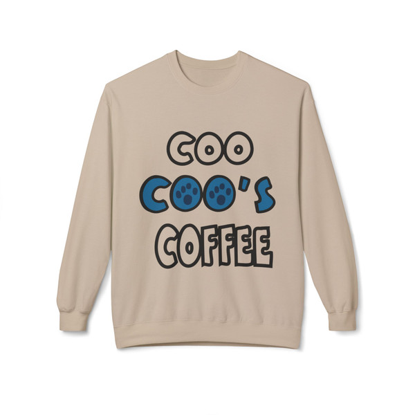 Sand crewneck sweatshirt featuring the bold “Coo Coo’s Coffee” logo in black and blue paw-print lettering across the chest.