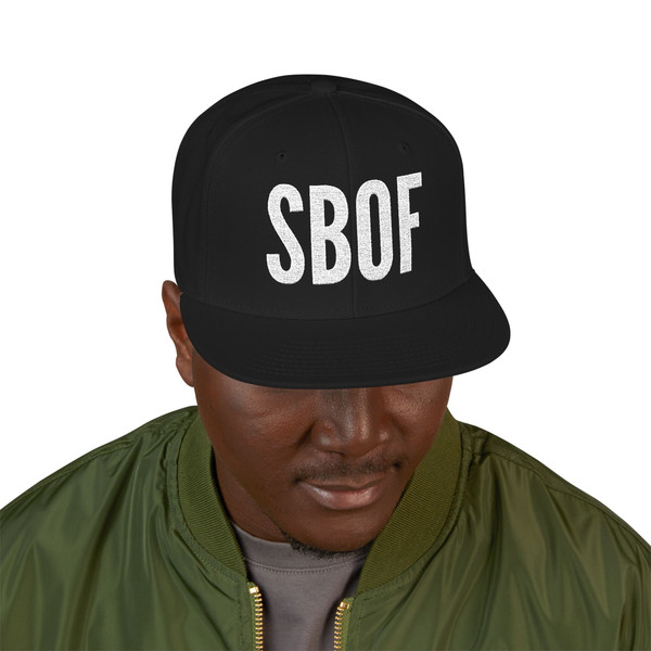 Black – "SBOF Snapback in black by Coo Coo’s Coffee – bold Small Batch of Friends cap with crisp white embroidery, perfect for coffee lovers and streetwear style." Top side view