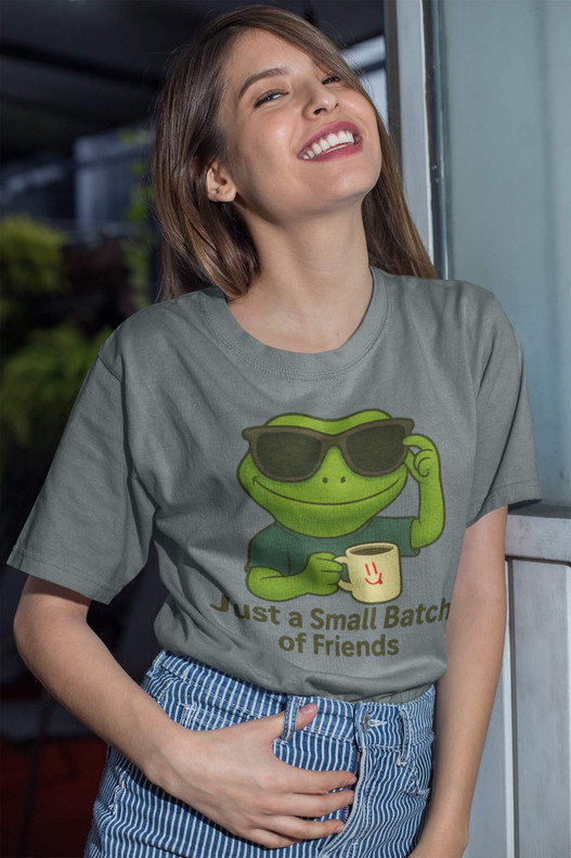 Woman smiling in Small Batch of Friends – Cool Gecko Tee by Coo Coo’s Coffee — chill gecko graphic with coffee mug and sunglasses, casual lifestyle shirt for coffee lovers.