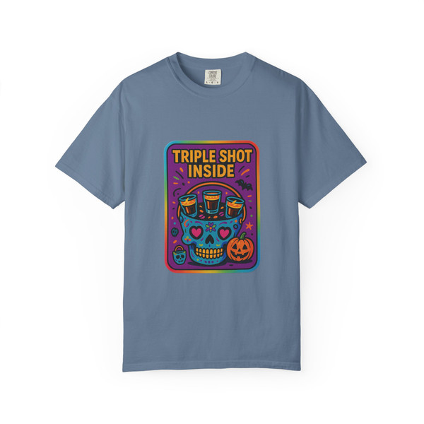 “Blue Jean tee featuring neon skull with triple shot coffee cup motif and pumpkin, slogan ‘Triple Shot Inside,’ Neon Skull Tee by Coo Coo’s Coffee.”