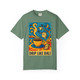 Drip Like Dalí – Surrealist Coffee Tee by Coo Coo’s Coffee in light green, designed with a vibrant Salvador Dalí-style coffee and clock motif.