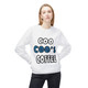 White crewneck sweatshirt featuring the bold “Coo Coo’s Coffee” logo in black and blue paw-print lettering across the chest. Female Model