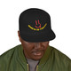 Black snapback hat with red smiley face and bold yellow “Brew Is Truth” text arched below the design. Coffee lifestyle streetwear from Coo Coo’s Coffee. Male model front