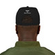 Black snapback hat with red smiley face and bold yellow “Brew Is Truth” text arched below the design. Coffee lifestyle streetwear from Coo Coo’s Coffee. Male model back