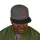 Black snapback hat with a bold red smiley face embroidered on the front and #SmallBatchOfFriends stitched on the back. Coffee-themed lifestyle hat by Coo Coo’s Coffee. Grey Black front male model