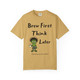 mustard t-shirt with a frazzled gecko holding coffee and the phrase “Brew First, Think Later – Fueled by Coo Coo’s Coffee”