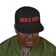 black snapback hat with red “brew is truth” embroidery and purple brim – coo coo’s coffee bold cap