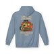 A unisex Stone Blue hoodie with Bert the gecko playing the drums in sunglasses and shorts, under the text More Coffee… More Cowbell – Coffee Roaster Tour. Bold, vintage band-tour style design by Coo Coo’s Coffee.