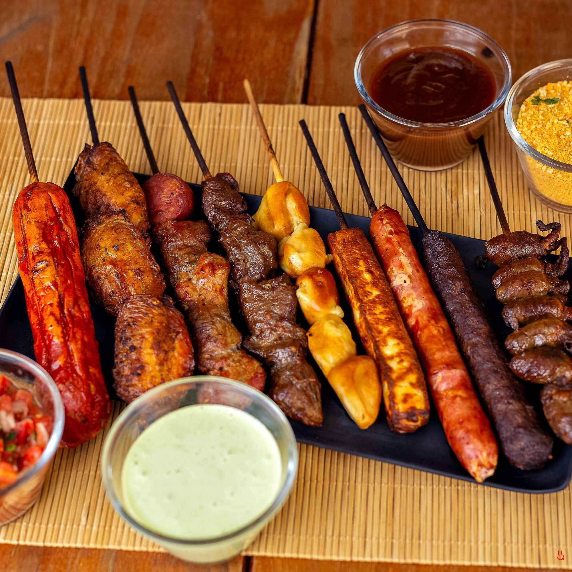 Brazilian barbecue spread with grilled meats and chimichurri