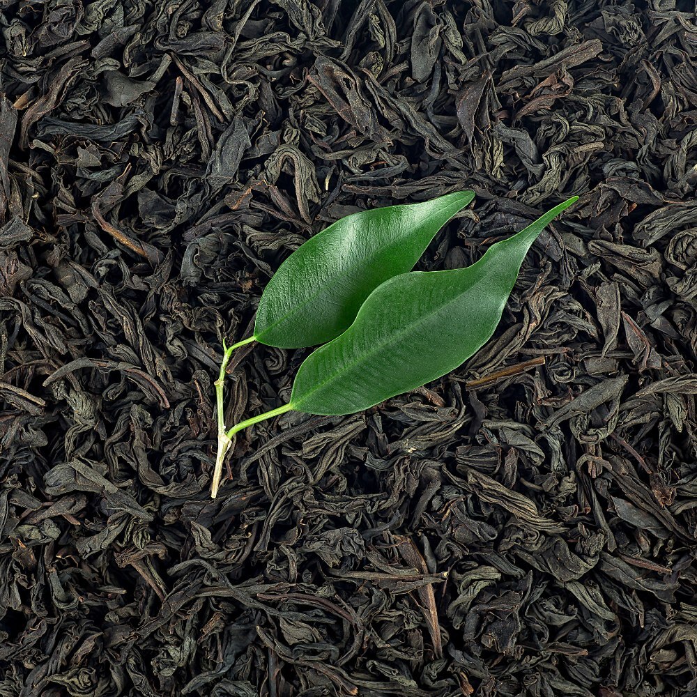 Loose black tea in a scoop (placeholder image)