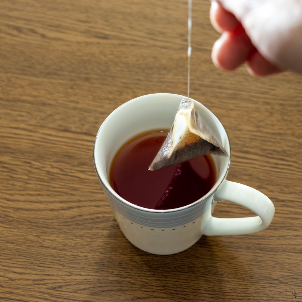 Strong brewed tea in a pot (placeholder image)