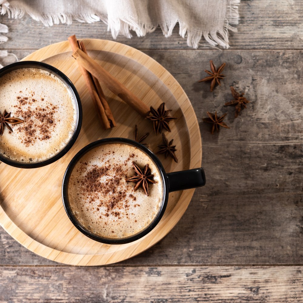 Chai in a mug with cinnamon sticks and spices (placeholder image)
