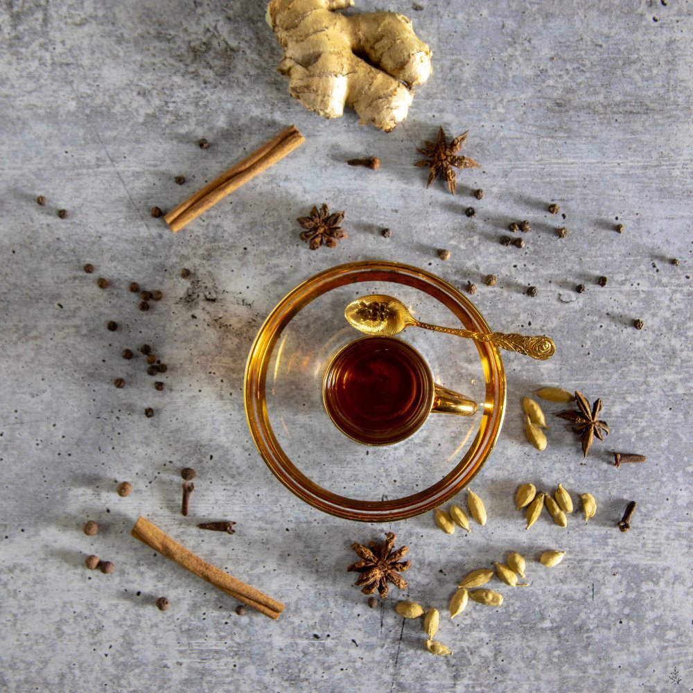 Tea, spices, milk, and sugar on a board (placeholder image)