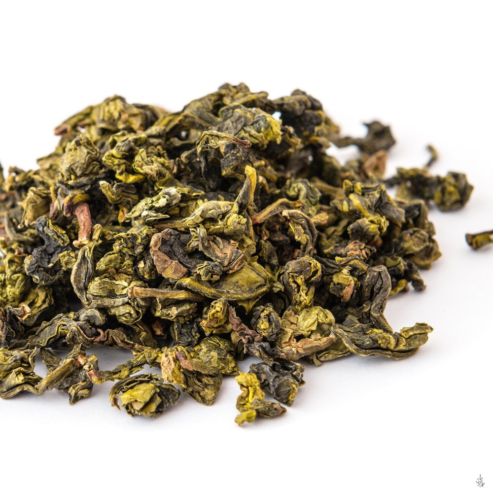 Tea leaves being rolled or shaped (placeholder image)