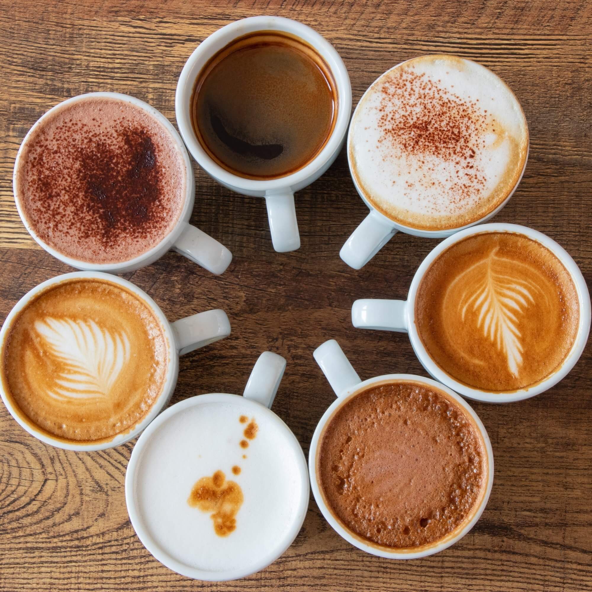 Coffee drinks and ingredients laid out for recipes